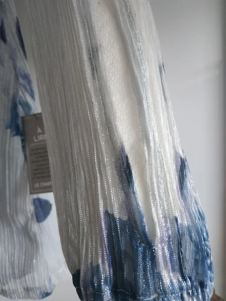 Silver dress with blue accents image indicator(4)