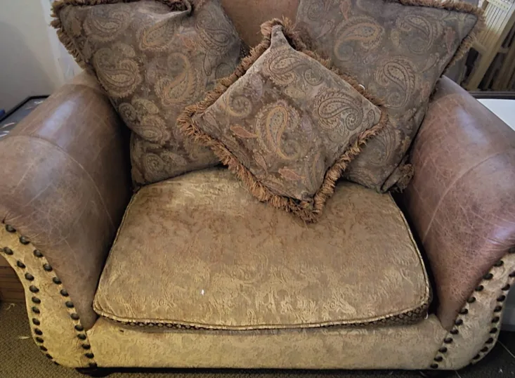 leather and material down studded chair and couch thumbnail