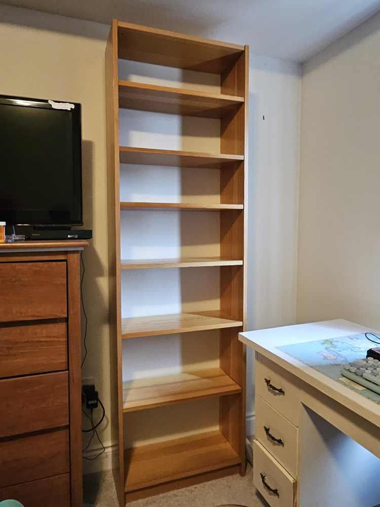 Tall wooden bookshelf