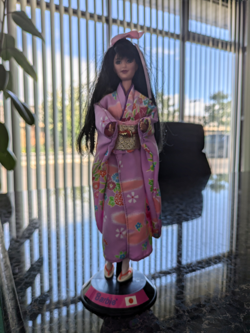 Japanese and Polynesian Barbie dolls and Paris doll