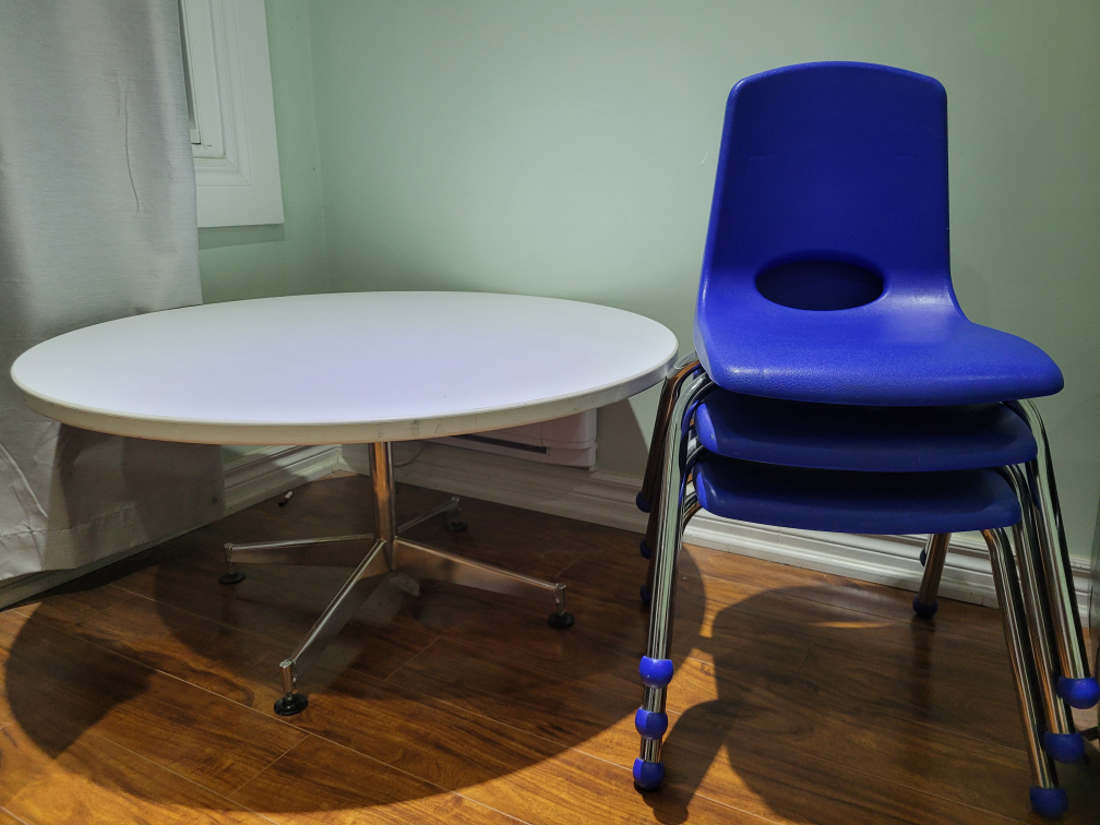 White Round Table and 3 Blue Chairs