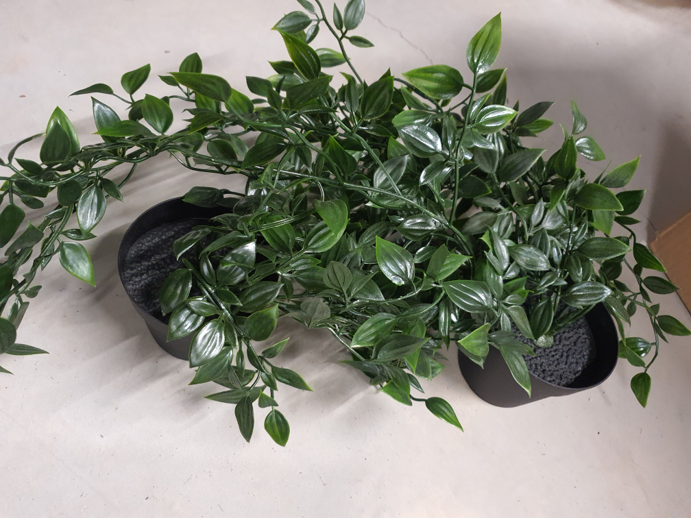 fake plants, candles, and glass mini owls for decoratio