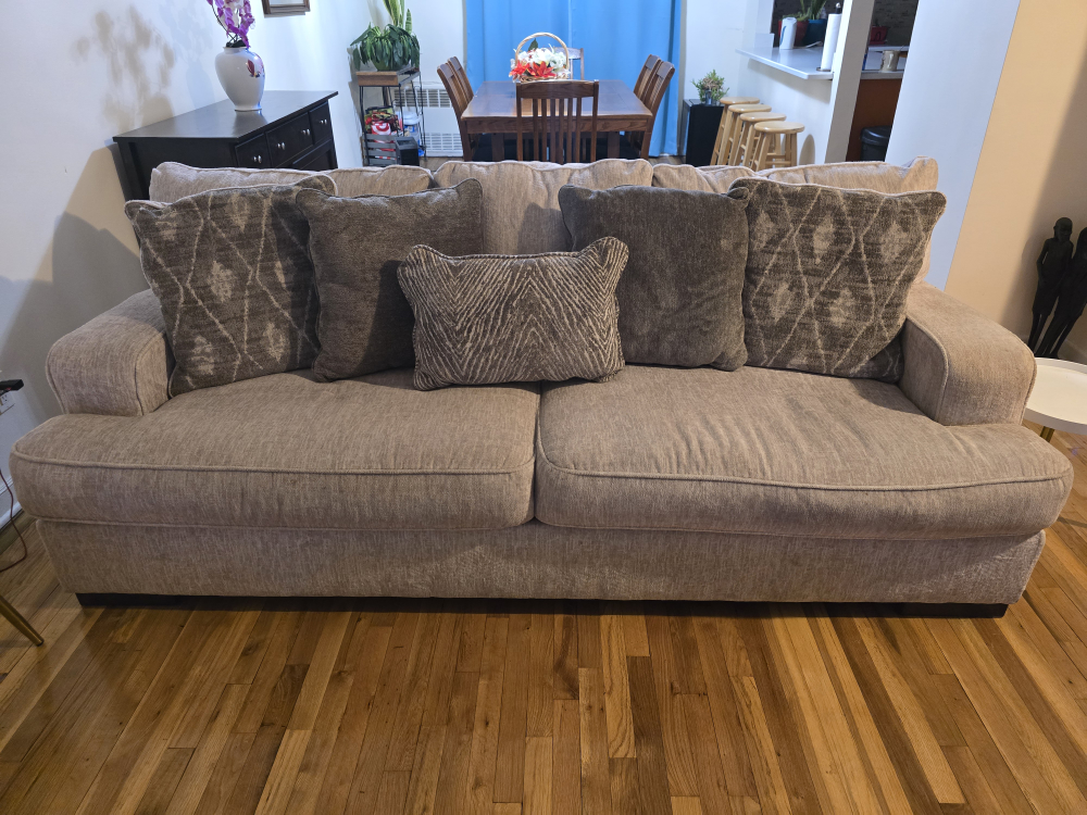 Beige Sofa With Five Throw Pillows