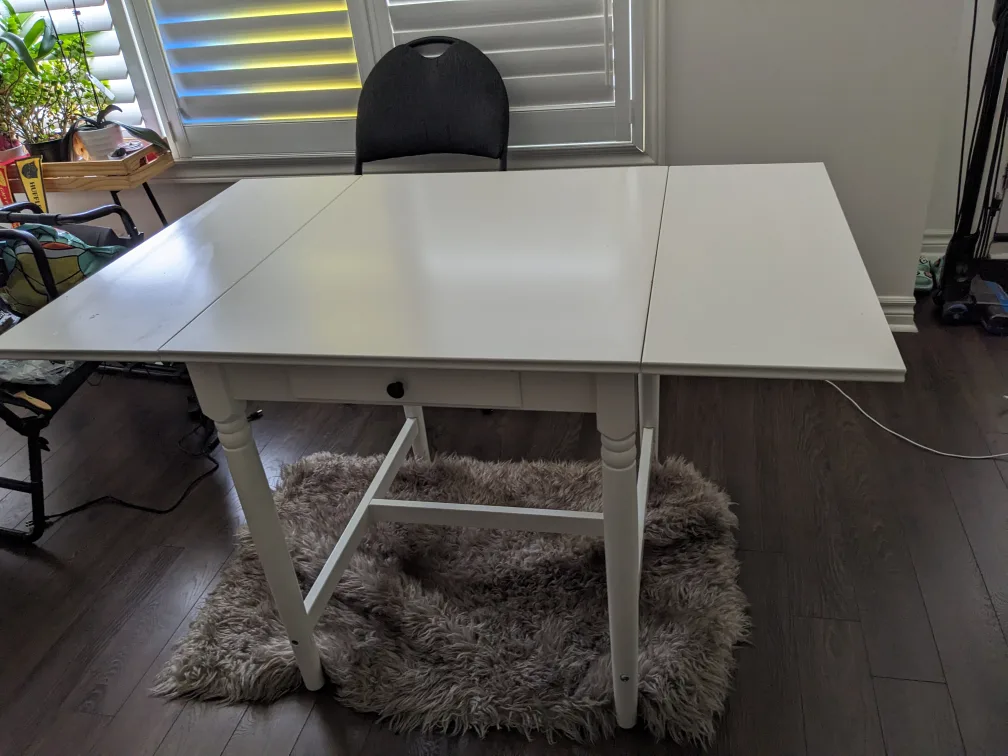 IKEA Drop-leaf table, dining table with a rug (photo) image indicator(2)