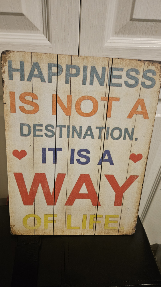 Happiness is not a destination, sign