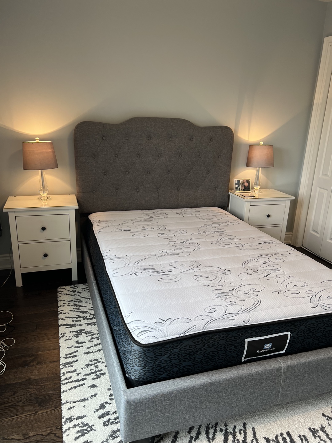 Full size bed in grey or beige, with box spring and mattress
