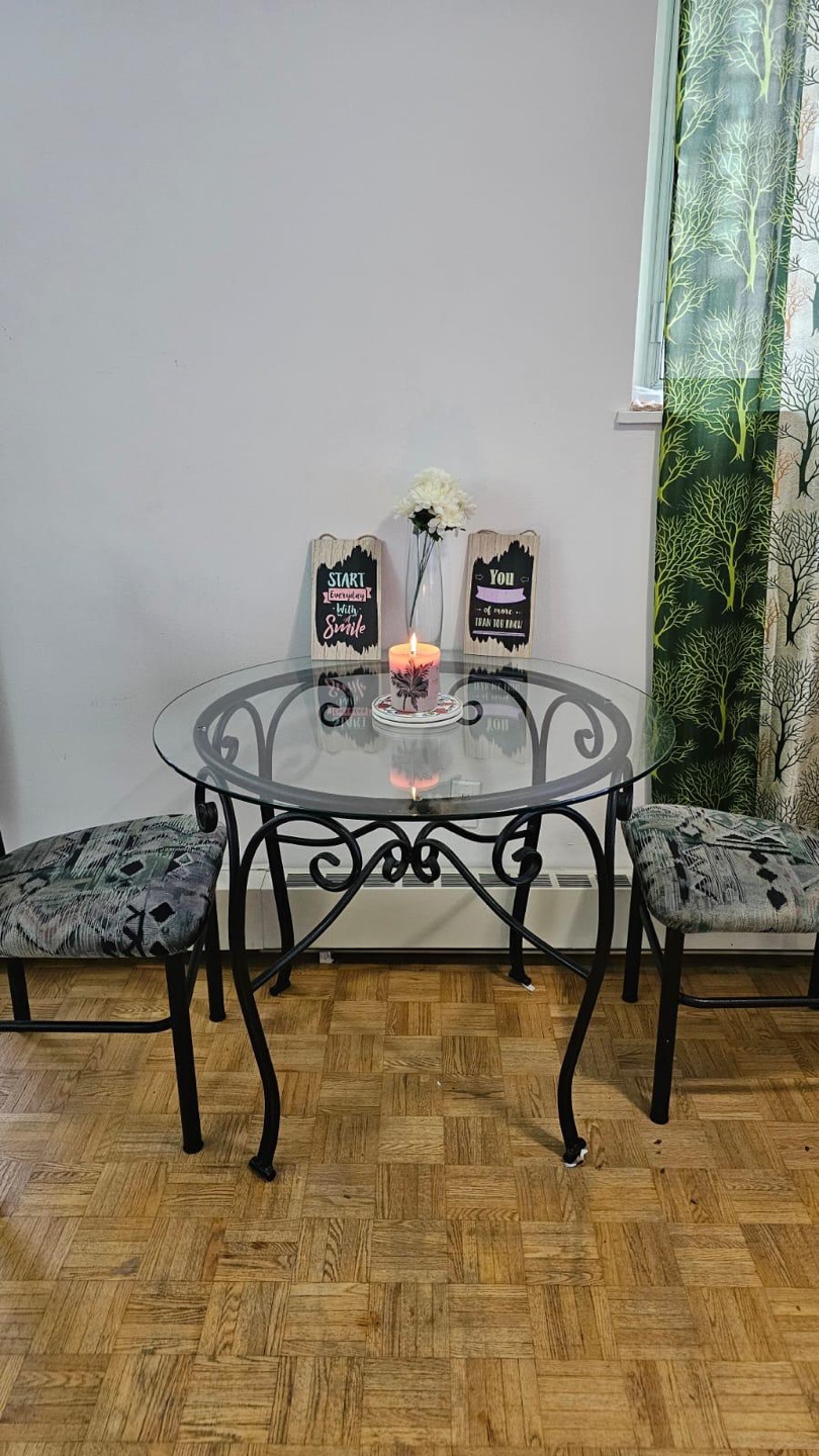 Glass top table with 2 Chair.