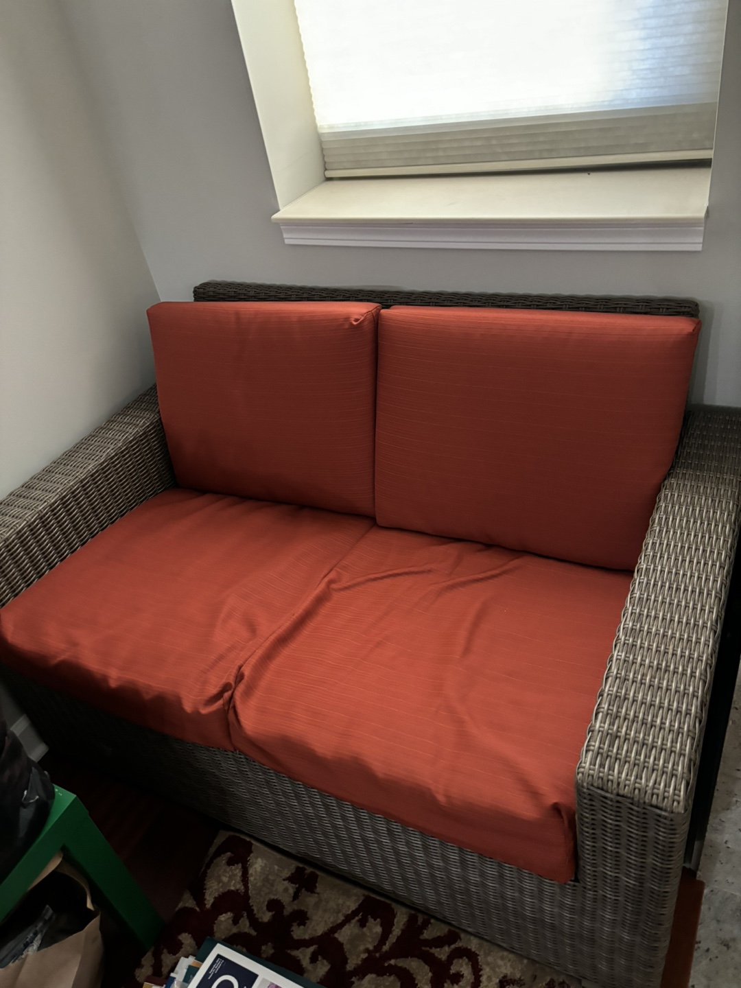 Wicker Loveseat with Orange Cushions