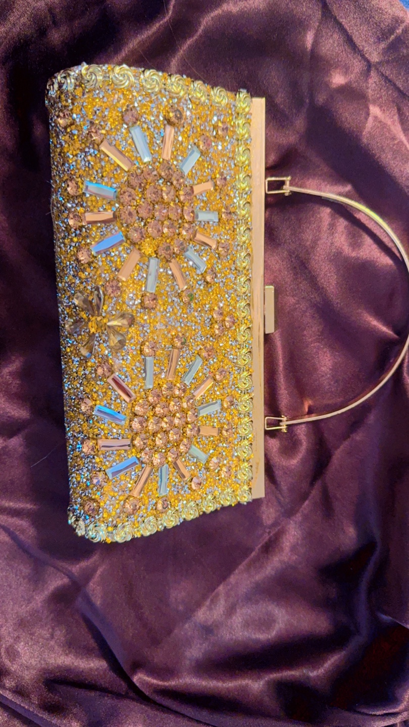 Gold Rhinestone Clutch can boost the price too
