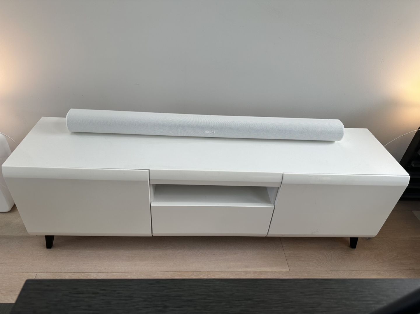 White Entertainment Unit with Black Legs