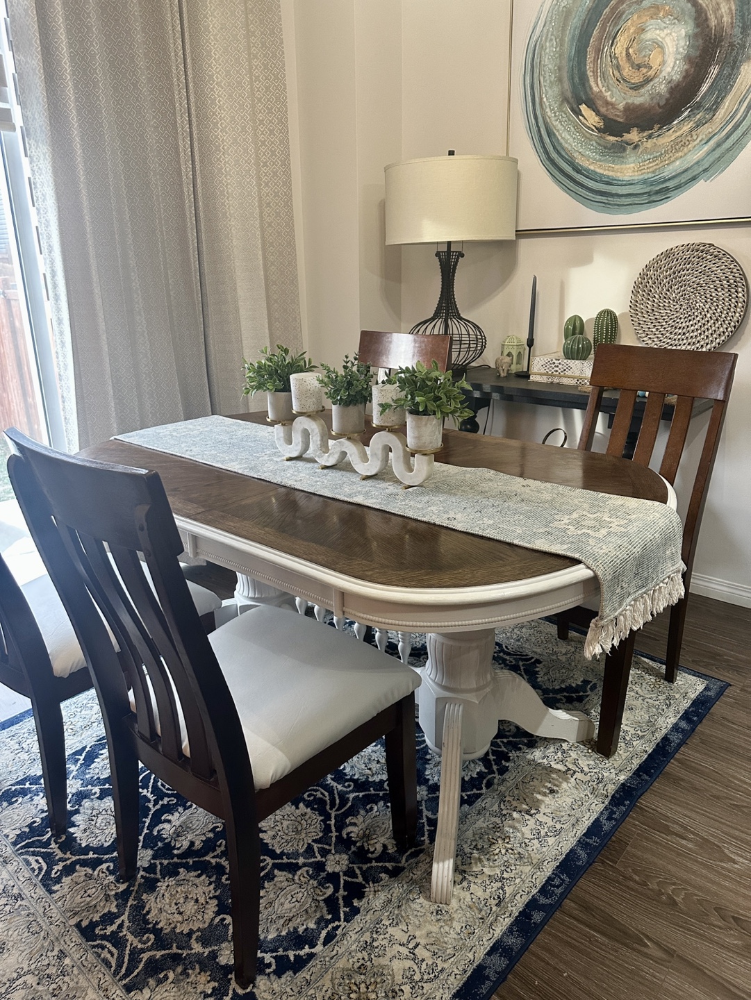 Oak dining table with four chairs