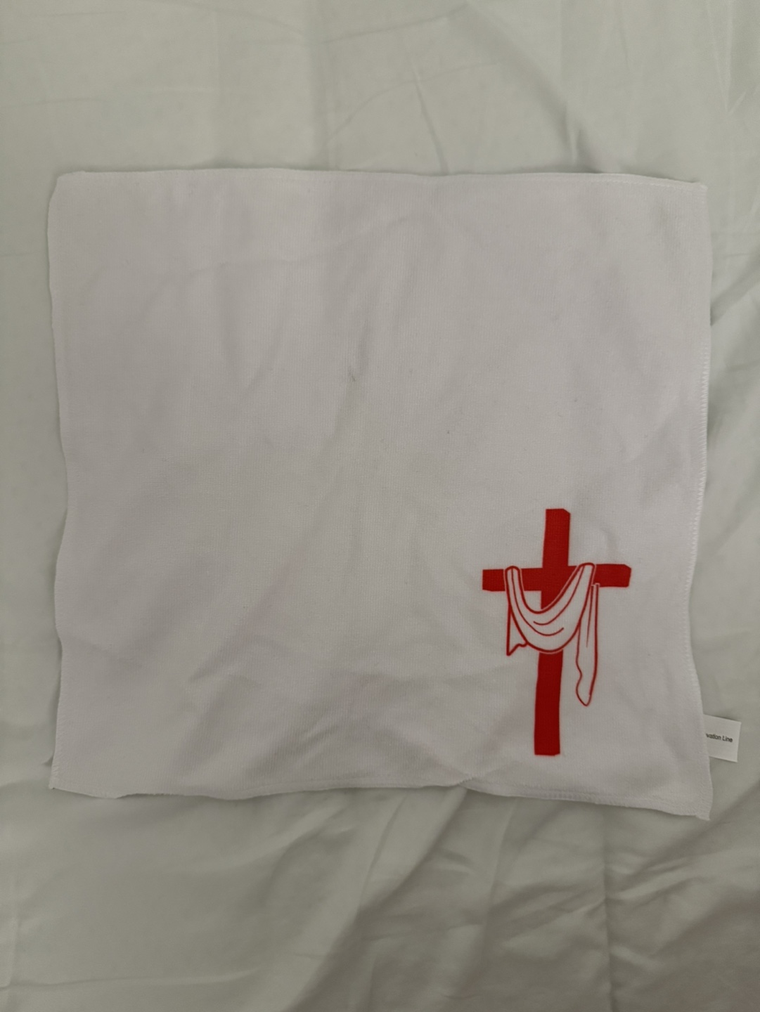 White towel with red cross