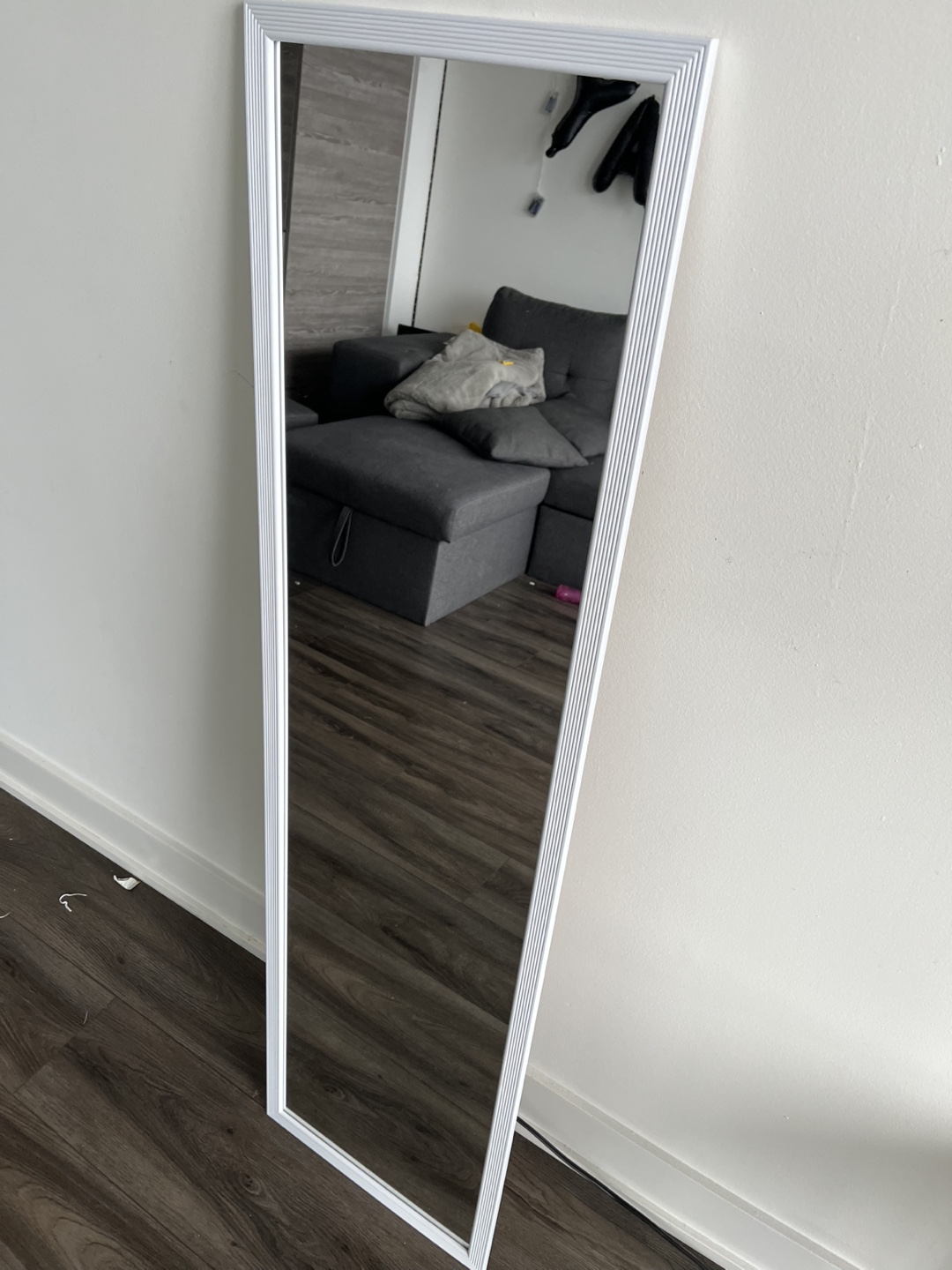 Full-length mirror with white frame