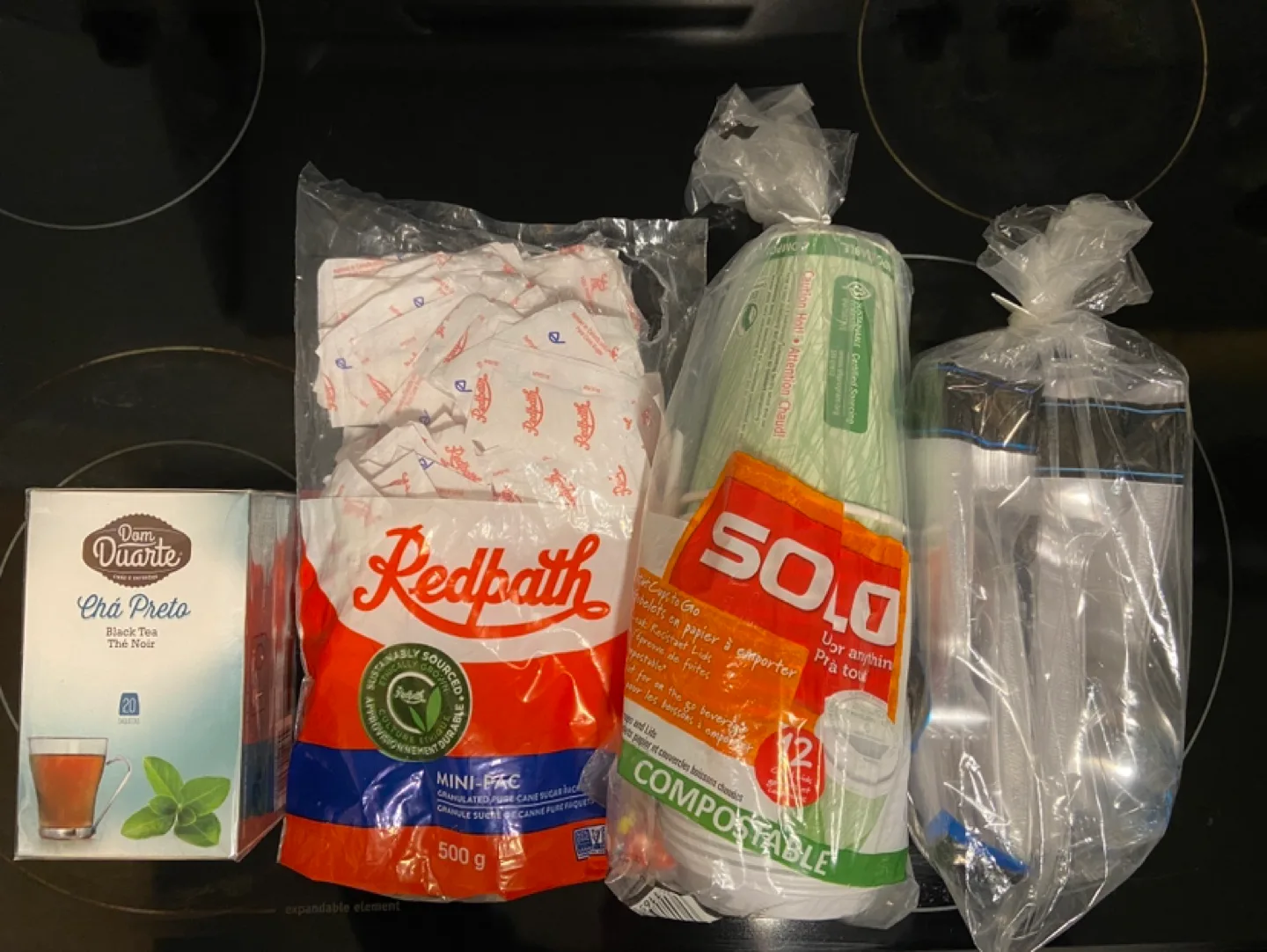 Catering supplies: sugar, cups, plastic cutlery, tea thumbnail