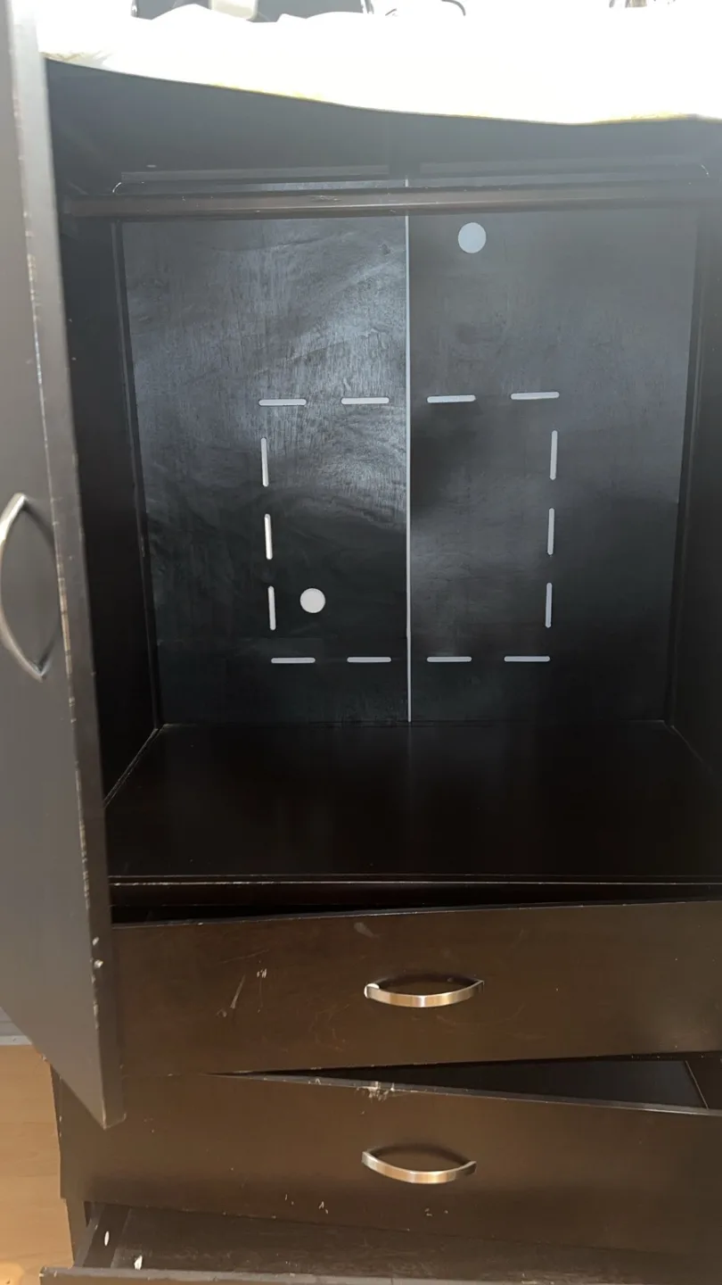 Dark brown wooden armoire with 3 drawers and a hanging rack image indicator(2)