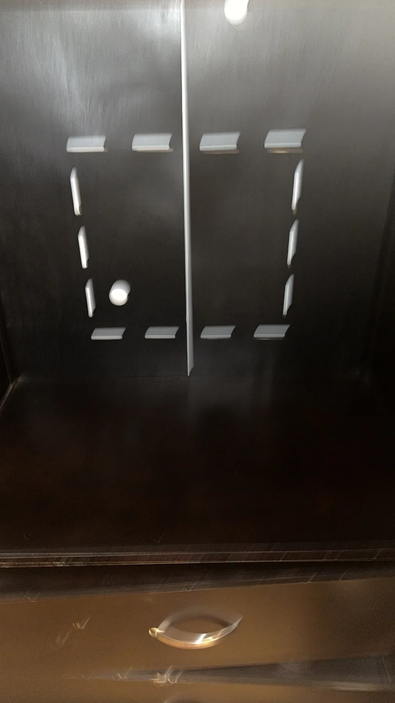 Dark brown wooden armoire with 3 drawers and a hanging rack image indicator(3)