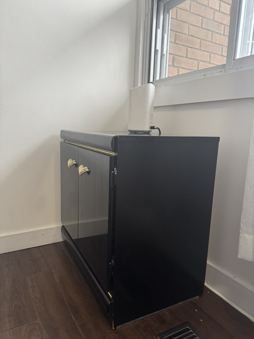 Black Cabinet with Gold Accents