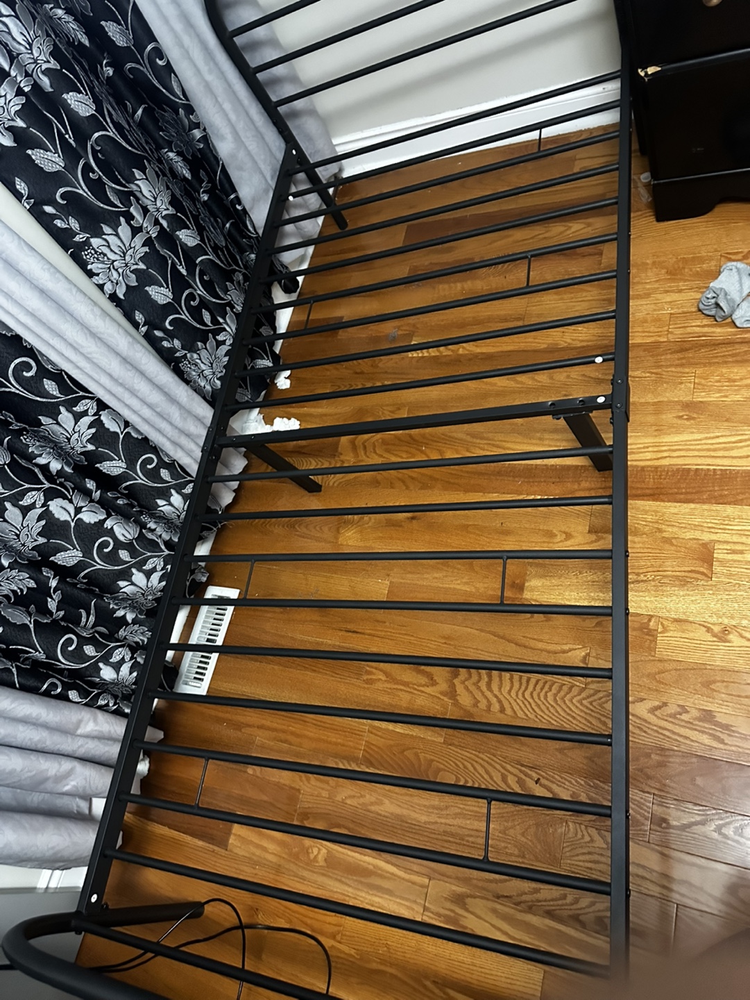 Black Nightstand and Metal Bed Frame