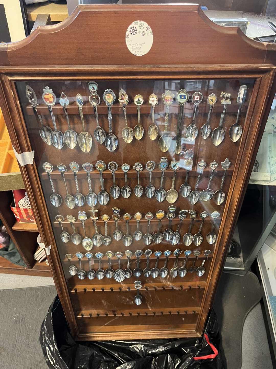 Collection of Souvenir Spoons in Display Case