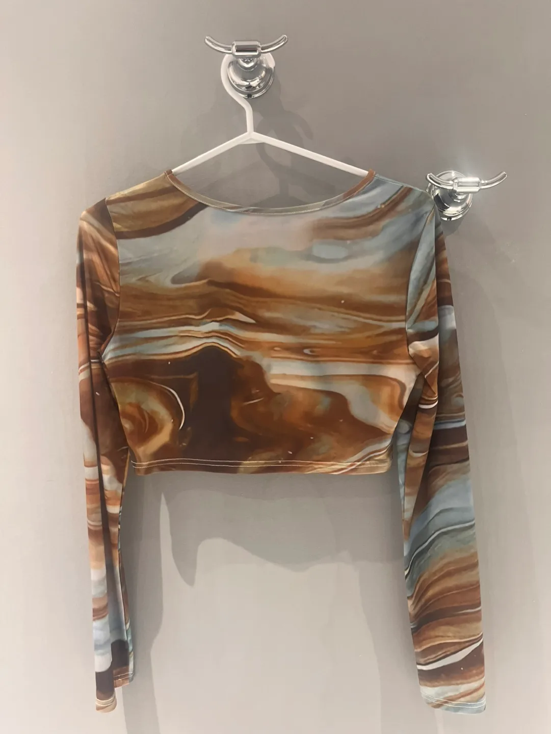 Brown and blue marble print long sleeve crop top image indicator(2)