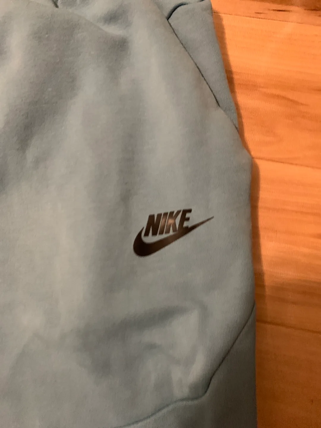 Blue nike tech pants image indicator(2)