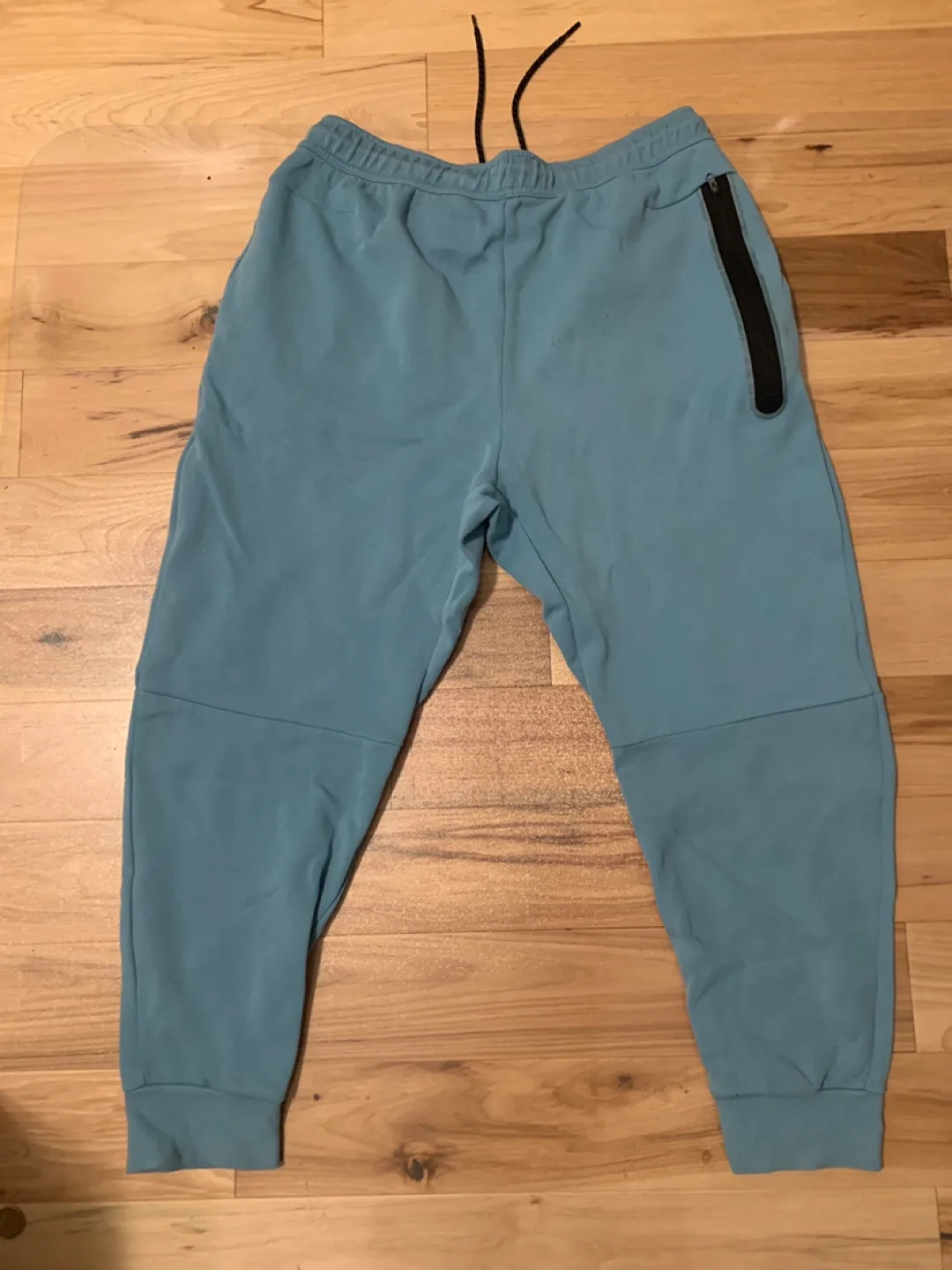 Blue nike tech pants image indicator(4)