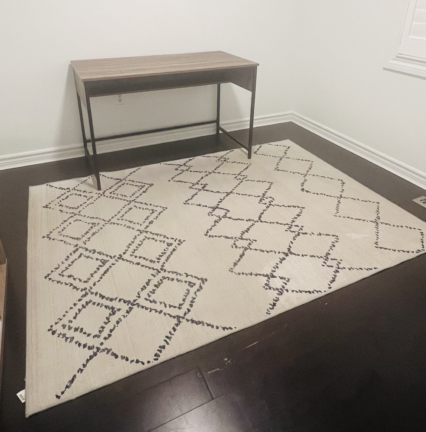 Large cream and black/navy blue rug