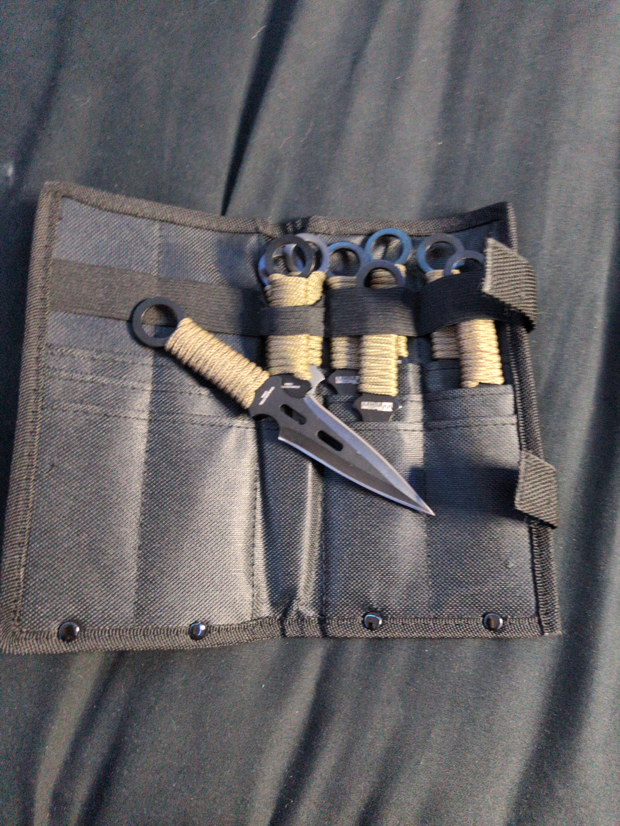 9 brand new throwing knives