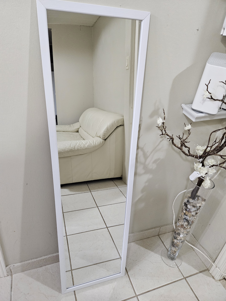 Full-length mirror with white frame