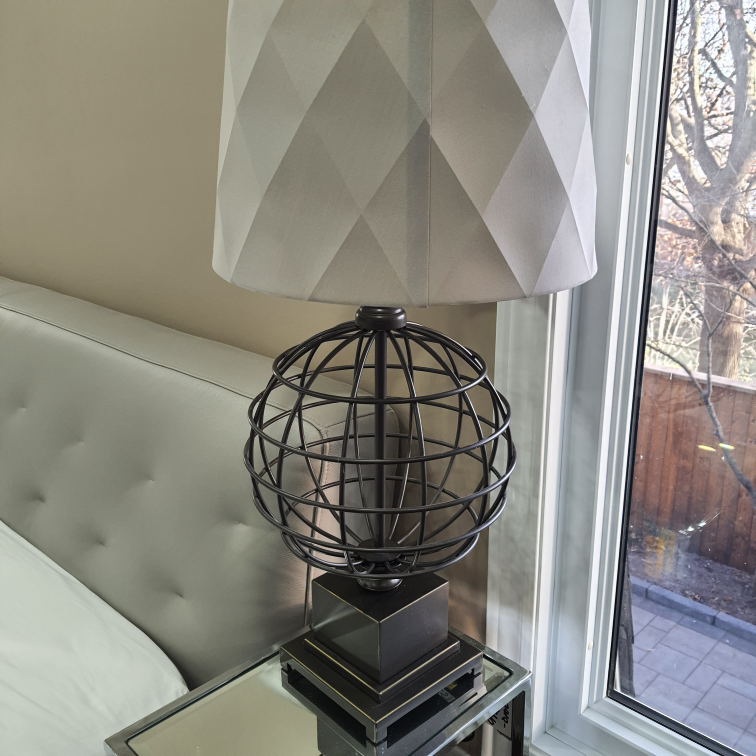 Table lamp with globe base and grey drum shade