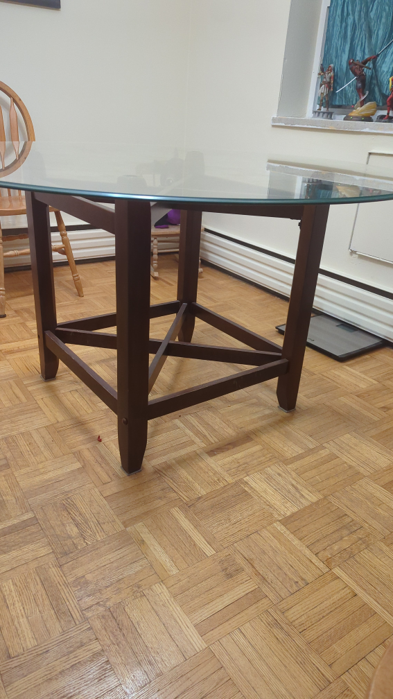 glass top table and 4 wooden chairs