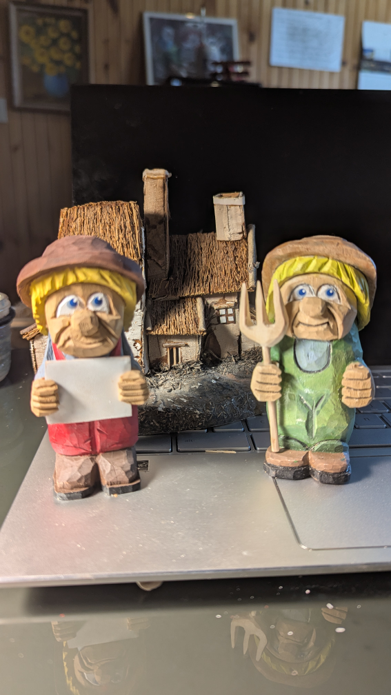 Two Hand-Carved Wooden Figurines