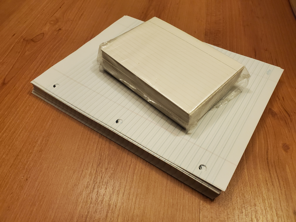 Bundle of wide rule paper and 130 flashcards.