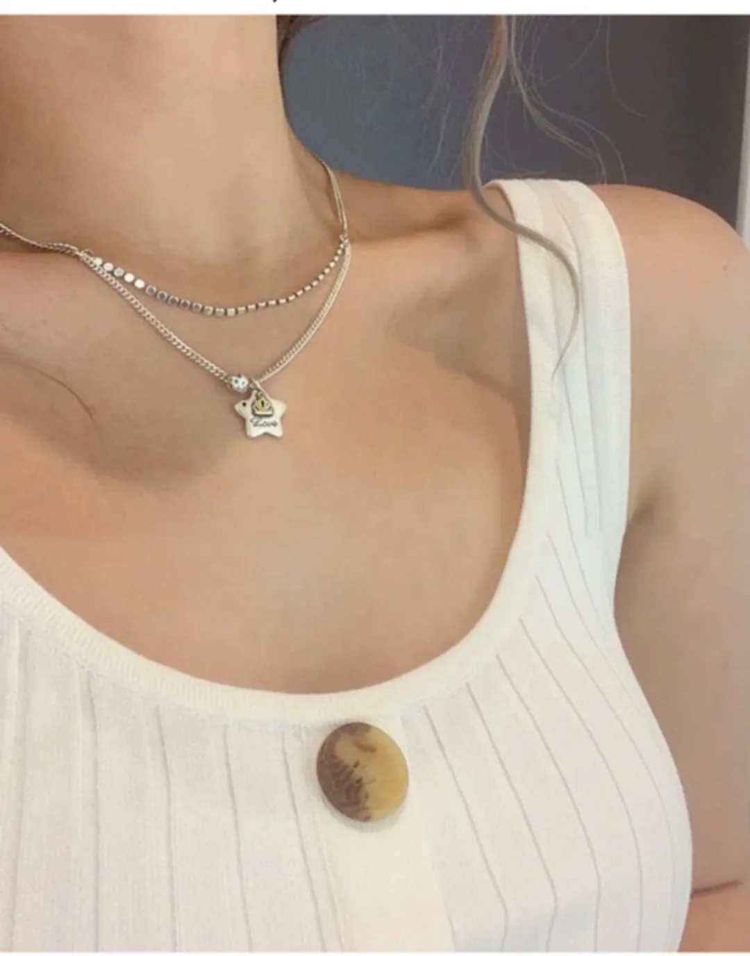 Silver Necklace with a star pendent image indicator(3)