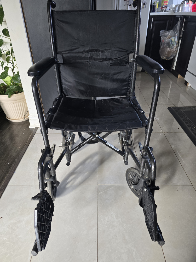 Black Folding Wheelchair like new, folding