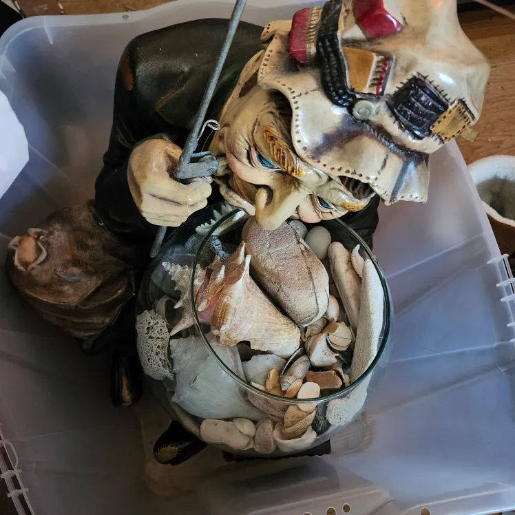 Fisherman Statue with Seashells thumbnail