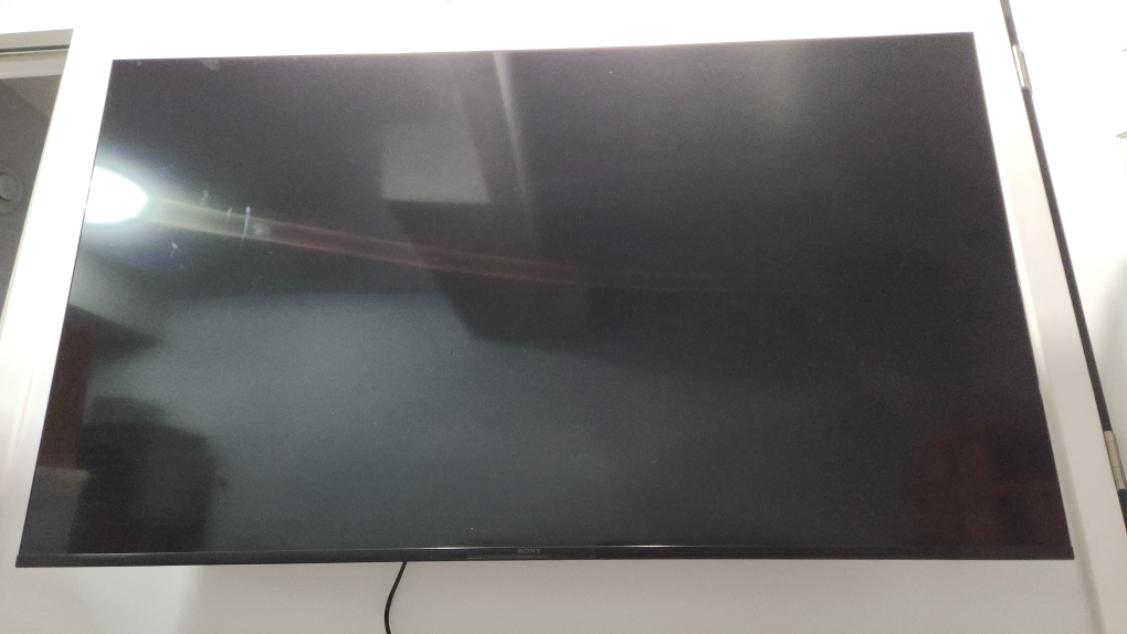 Sony Bravia 65" 4K TV with remote and articulating mount