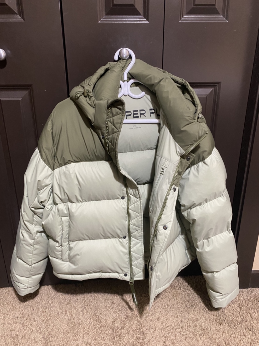 The Super Puff Jacket in green.