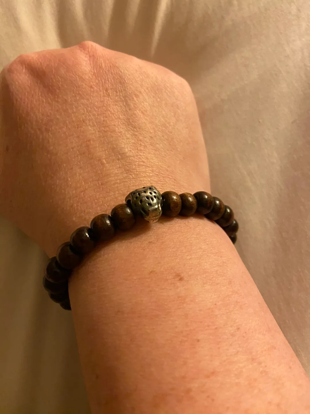 Wooden beaded bracelet with silver charm image indicator(2)