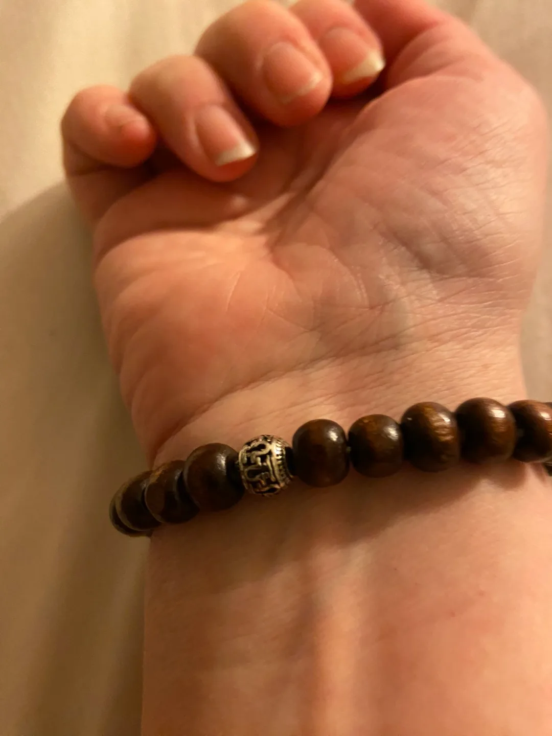 Wooden beaded bracelet with silver charm image indicator(3)