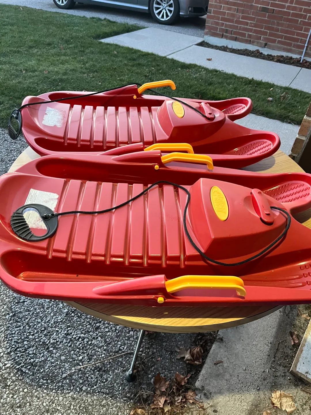 Two red Pelican brand Sleds thumbnail
