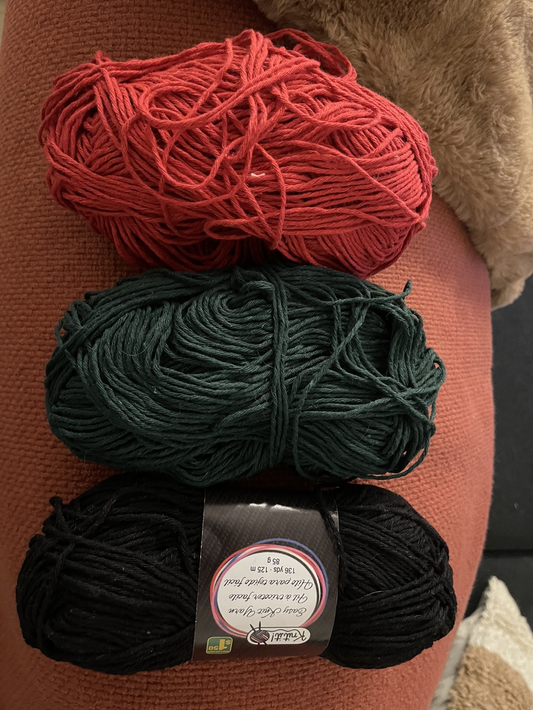 Red, green and black yarn