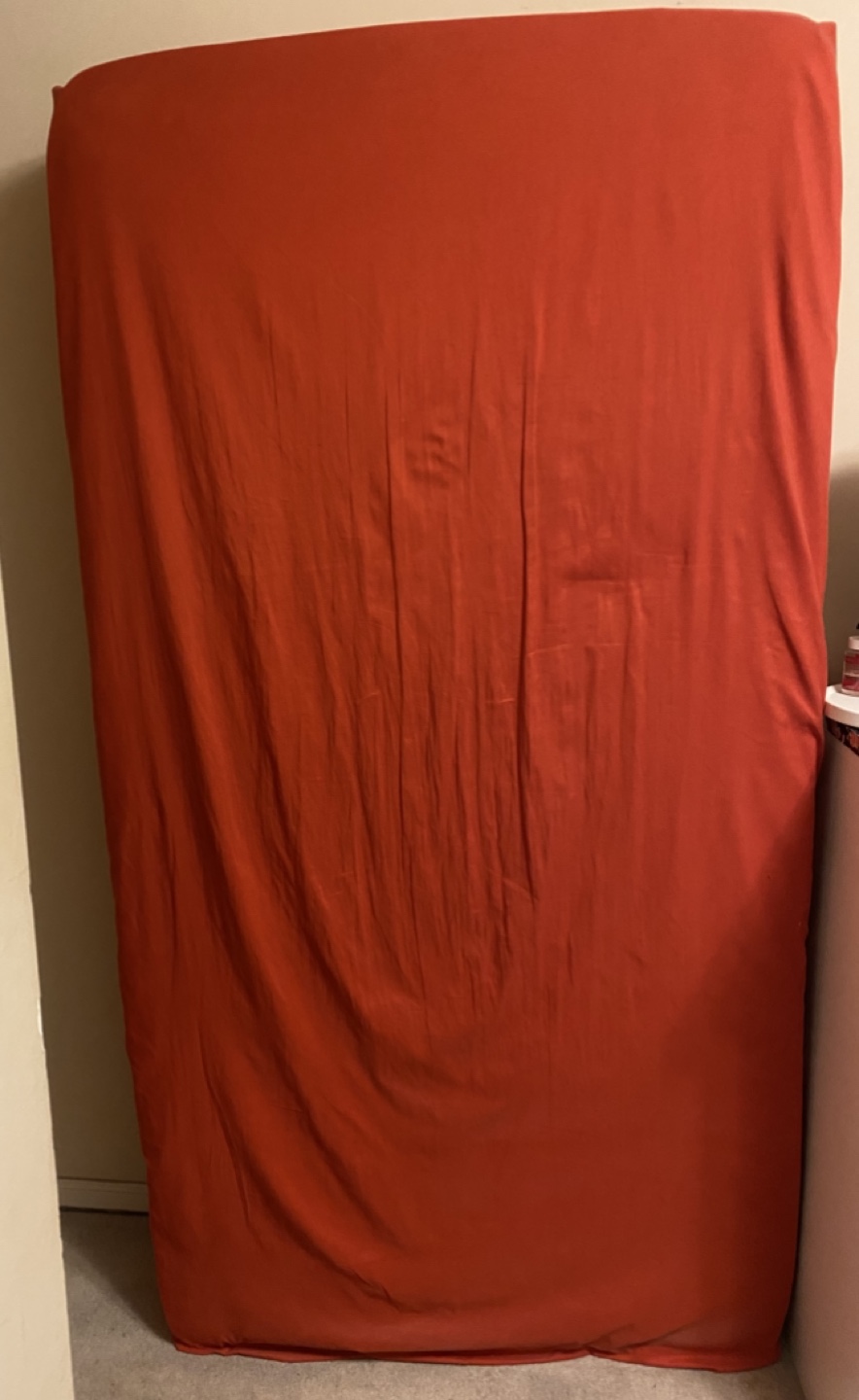 Single metress with Red Fitted Sheet