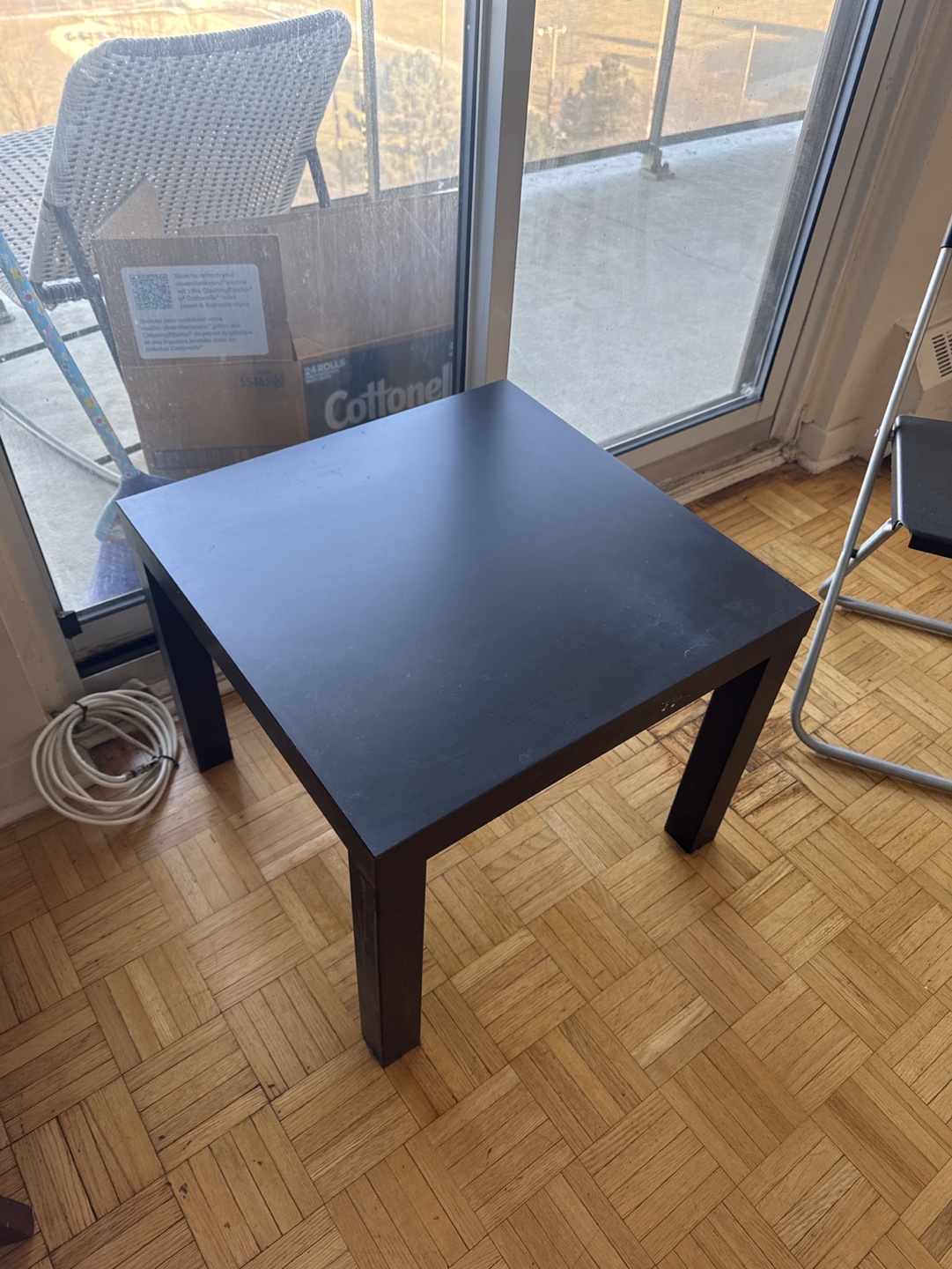 Black folding chairs and side table
