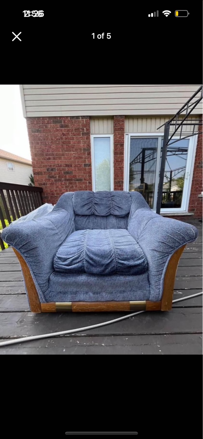 Blue corduroy armchair with wooden accents