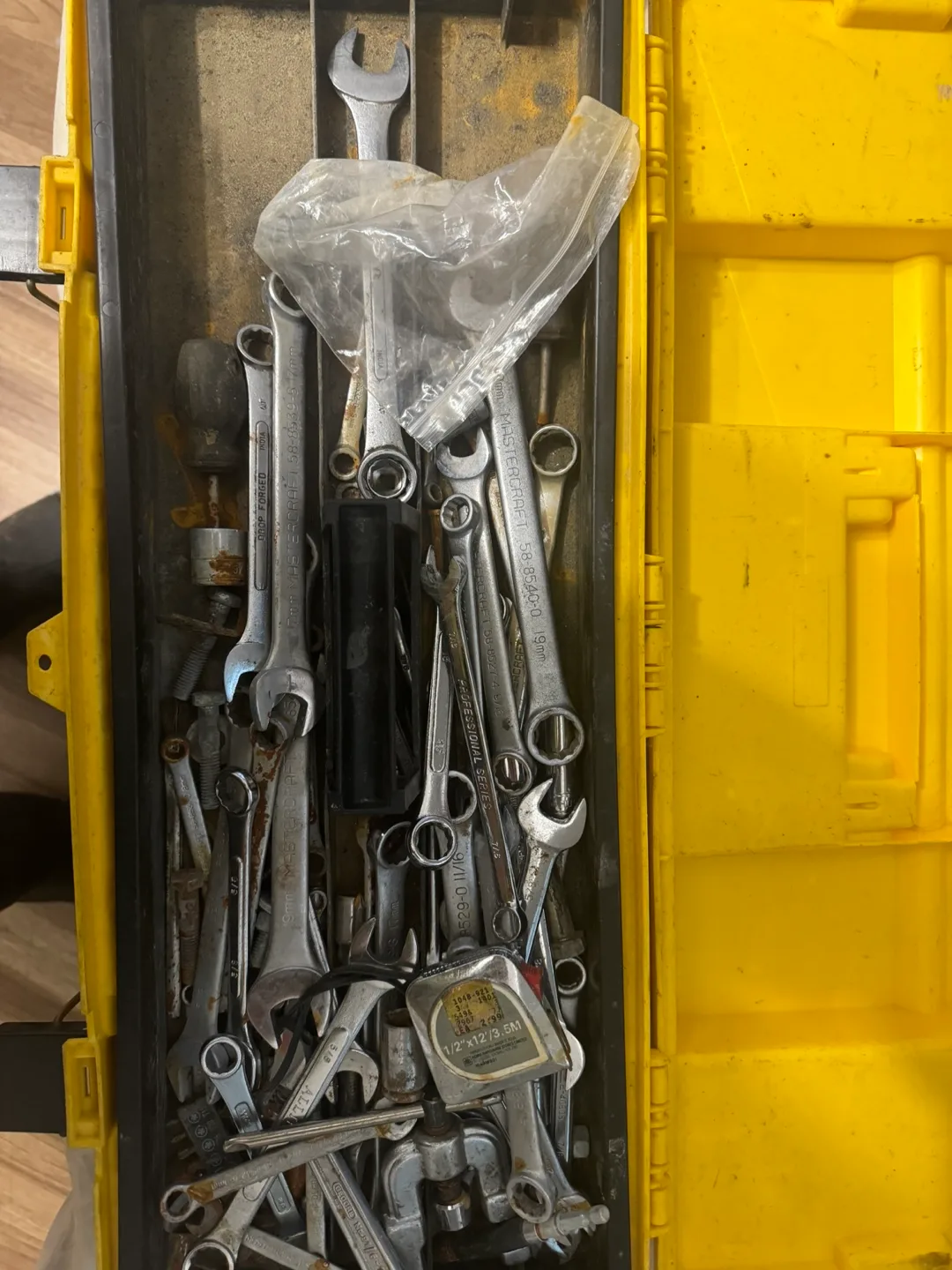 Assorted Wrenches and Tools in Yellow Toolbox thumbnail