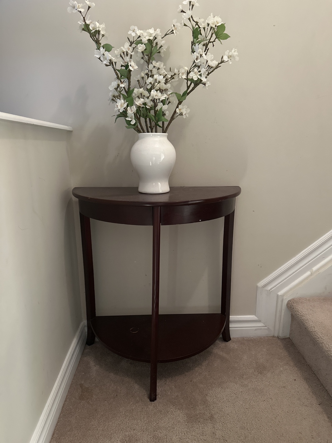 Dark brown half-moon console table