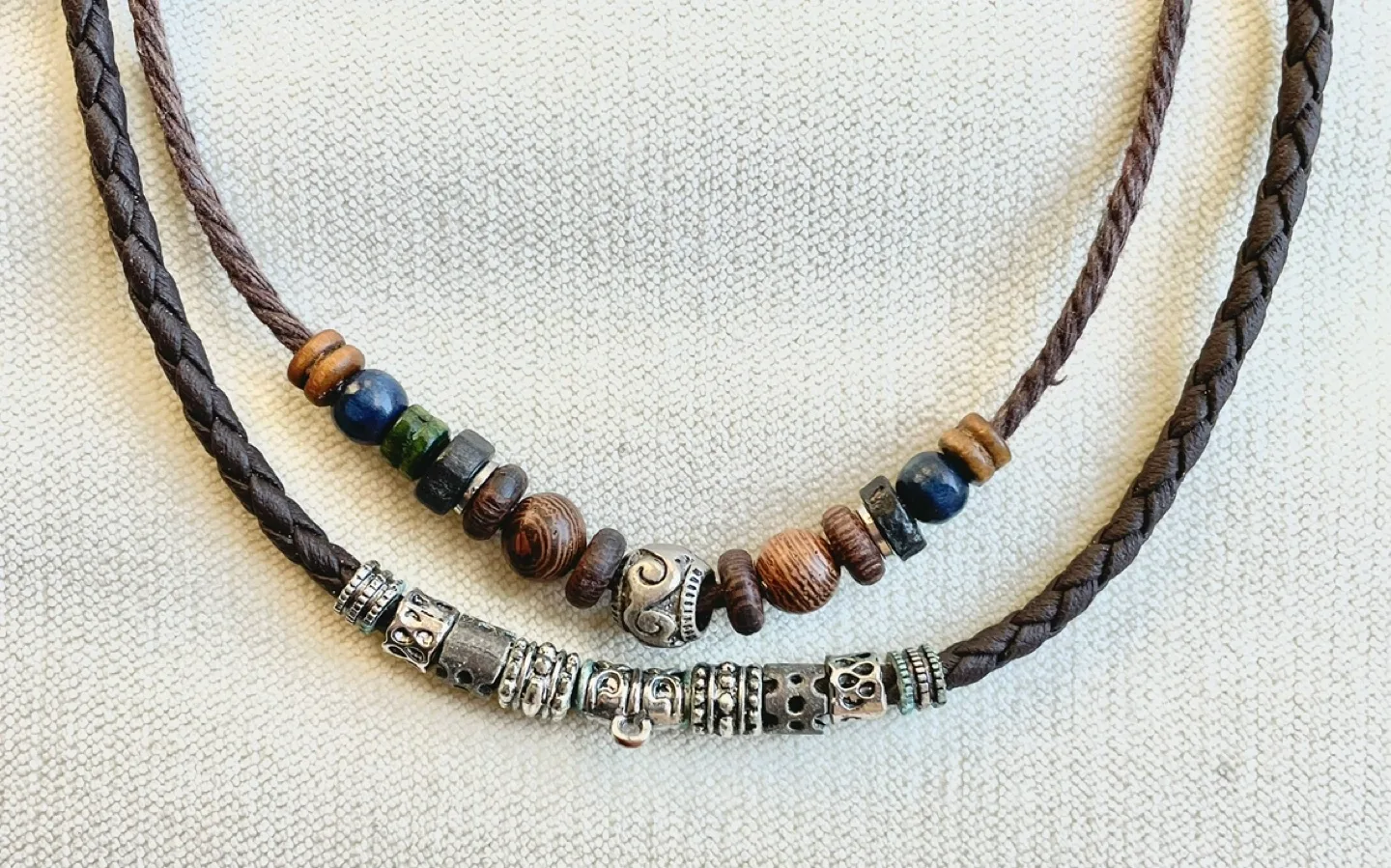 HANDMADE BEAD AND CHARM NECKLACE WITH BRAIDED LEATHER image indicator(2)