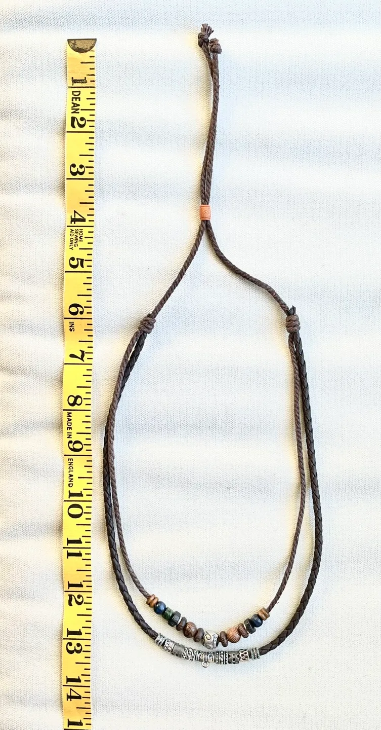 HANDMADE BEAD AND CHARM NECKLACE WITH BRAIDED LEATHER image indicator(3)