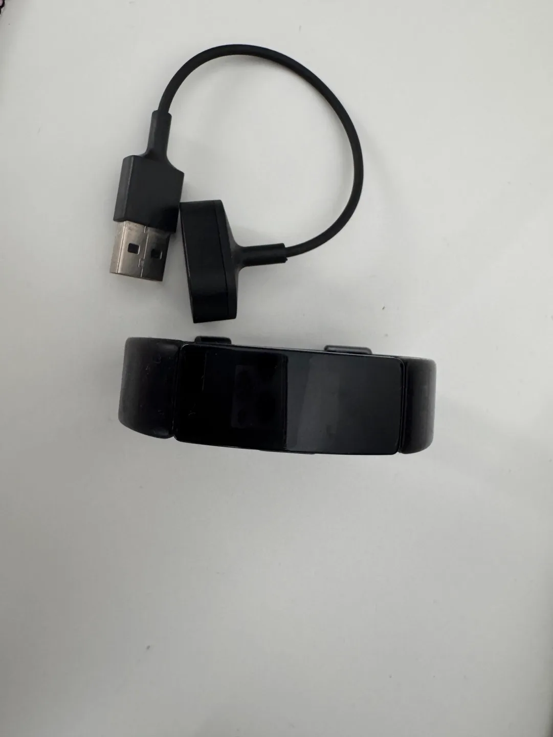Fitbit Inspire Fitness Tracker with charger thumbnail